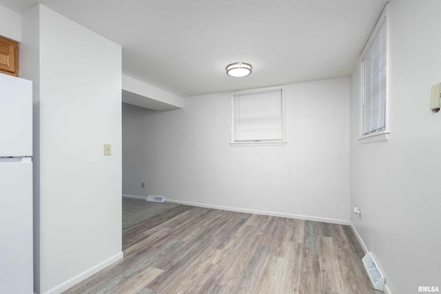 spare room with light hardwood / wood-style floors