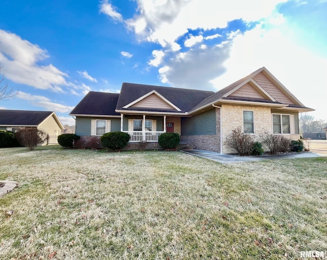 ranch-style home with a porch and a front yard