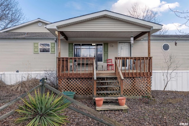 back of house featuring covered porch