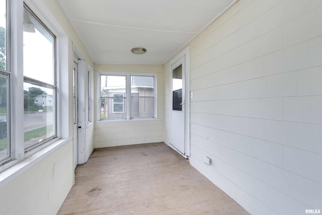 unfurnished sunroom with a wealth of natural light