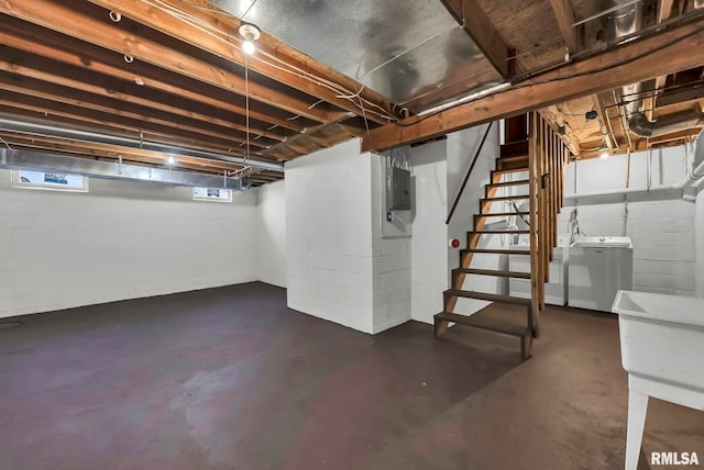 basement with washer / clothes dryer and electric panel