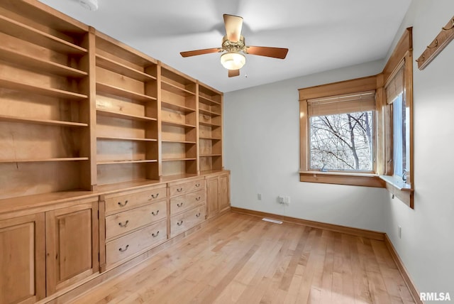 unfurnished bedroom featuring light wood-type flooring and ceiling fan