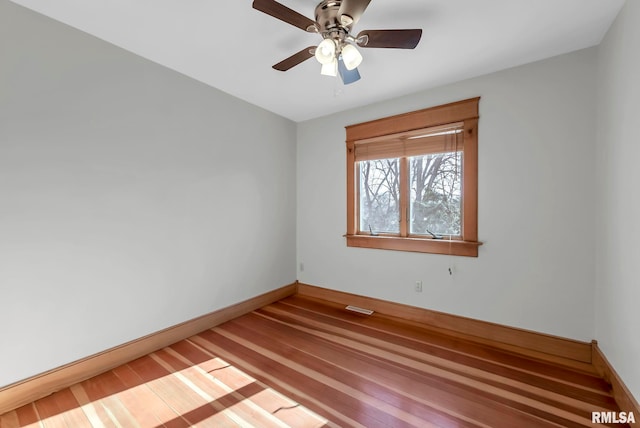 unfurnished room featuring ceiling fan and hardwood / wood-style floors