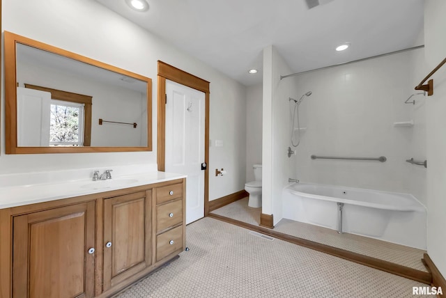 bathroom featuring vanity, tile patterned floors, and toilet