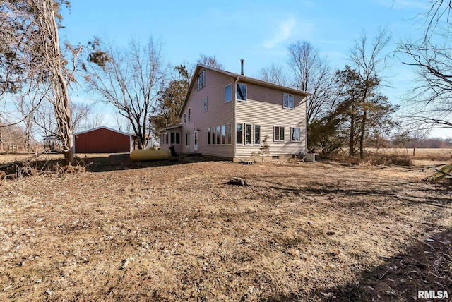 rear view of house with cooling unit