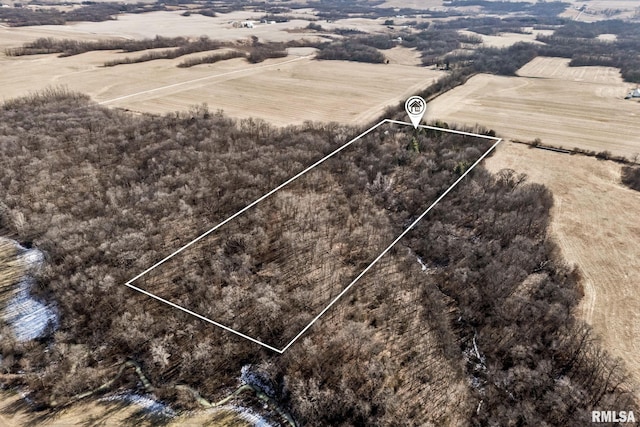 birds eye view of property with a rural view