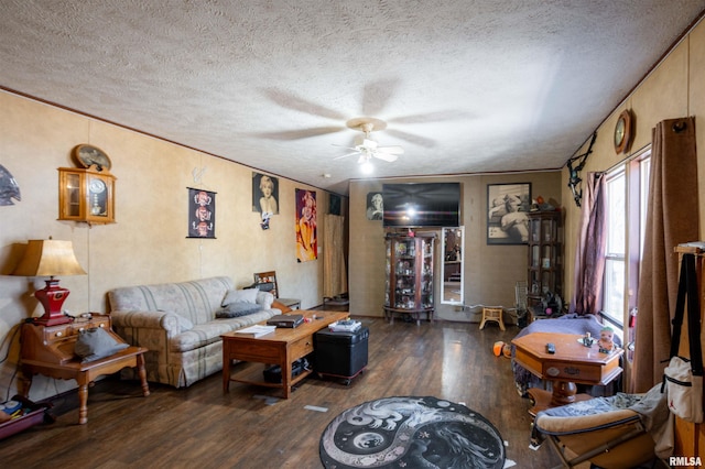 living room with dark wood-type flooring, ceiling fan, crown molding, and a textured ceiling