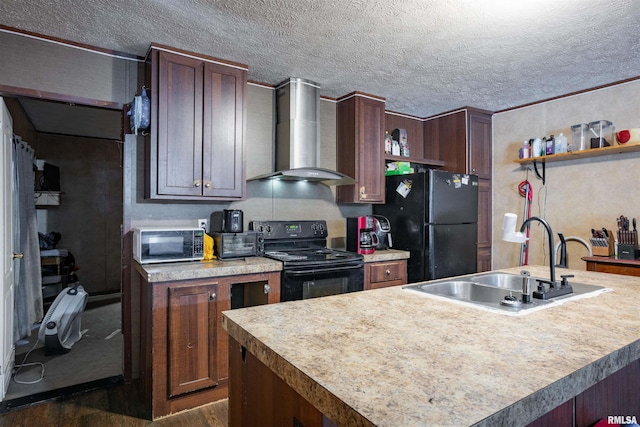 kitchen featuring sink, black appliances, an island with sink, and wall chimney exhaust hood