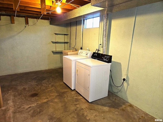 laundry room with independent washer and dryer and sink