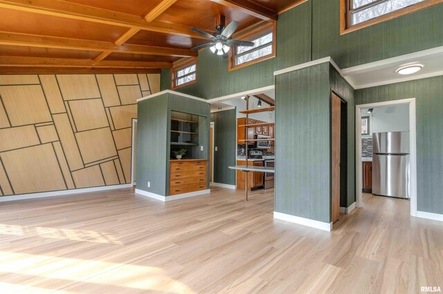 unfurnished living room with dark colored carpet, a textured ceiling, ceiling fan, and baseboard heating