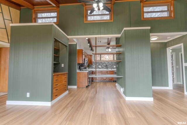 empty room with baseboard heating, dark hardwood / wood-style floors, and a textured ceiling