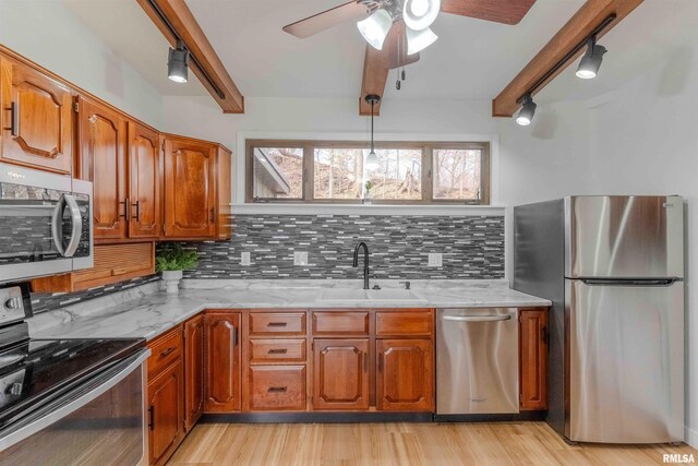 unfurnished bedroom with baseboard heating, beam ceiling, carpet floors, and a closet