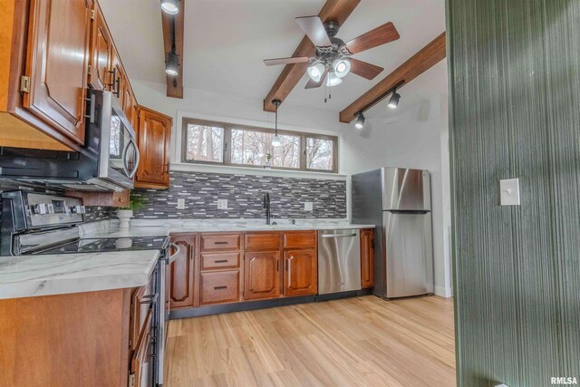 carpeted empty room with lofted ceiling with beams, ceiling fan, and baseboard heating