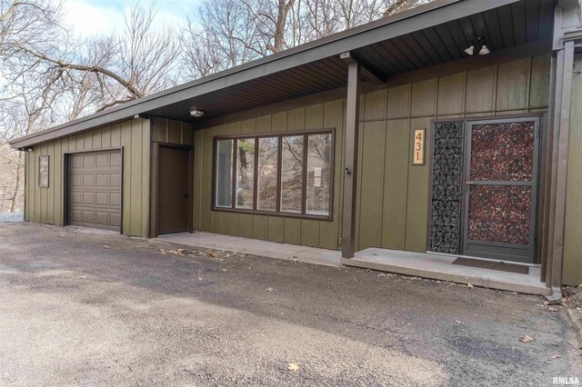 view of side of property featuring a garage