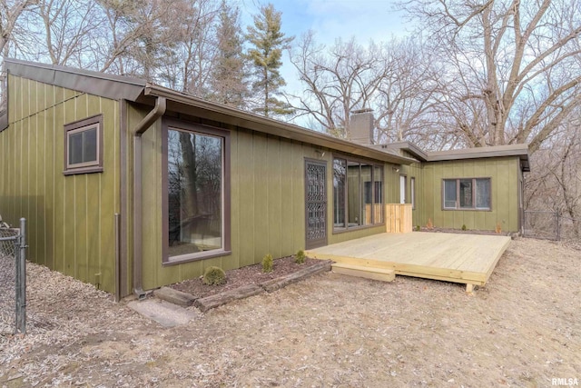 rear view of house with a wooden deck