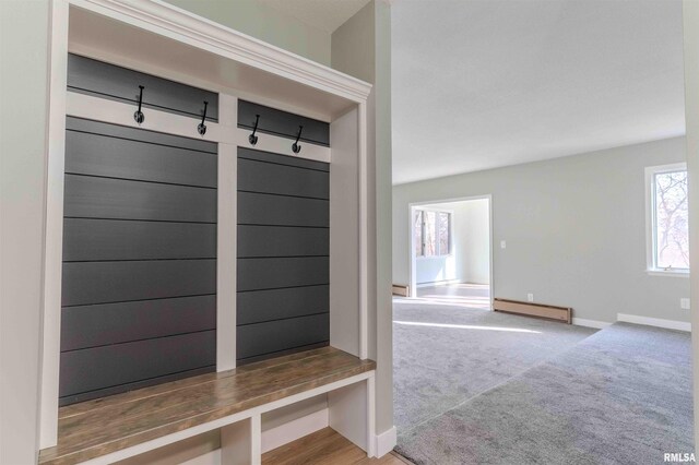 interior space with a wall mounted AC and light hardwood / wood-style flooring