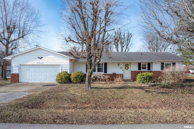 ranch-style home with driveway, an attached garage, and brick siding