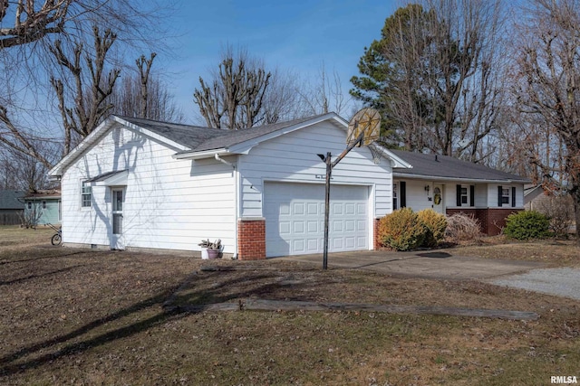single story home with a garage, brick siding, and driveway