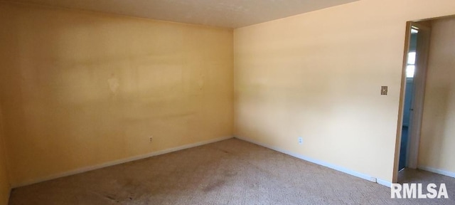 empty room featuring carpet floors