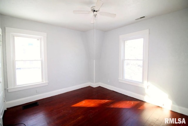 unfurnished room with hardwood / wood-style flooring and ceiling fan