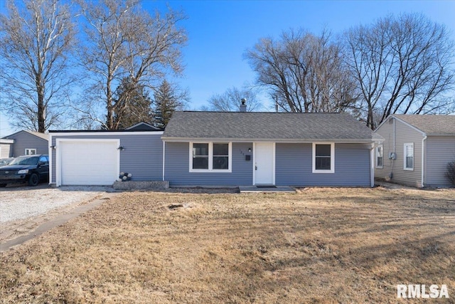 single story home with a shingled roof, a front yard, and an attached garage