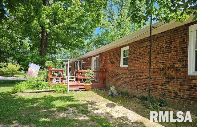 view of yard with a wooden deck