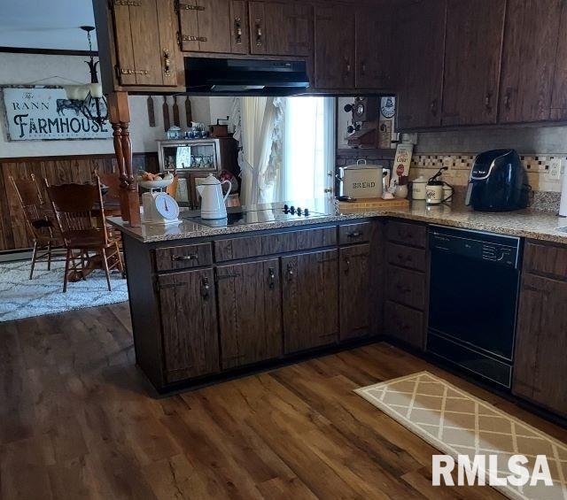 kitchen with black appliances, backsplash, dark brown cabinetry, kitchen peninsula, and dark wood-type flooring