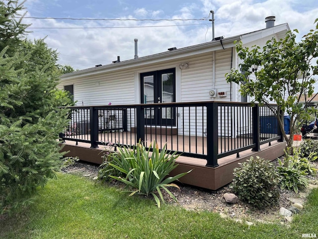 back of property featuring a wooden deck