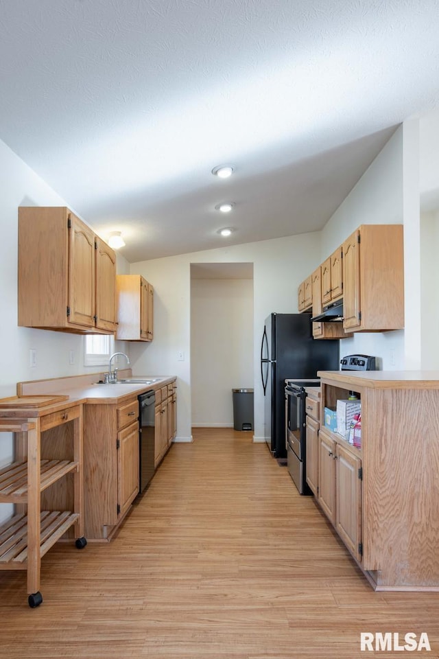 kitchen featuring sink, electric range, black dishwasher, light hardwood / wood-style floors, and light brown cabinetry