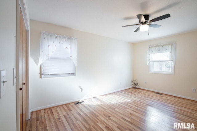 unfurnished room featuring light hardwood / wood-style floors and ceiling fan