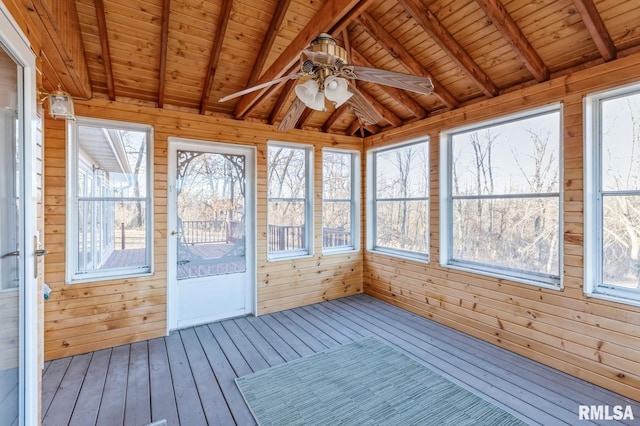 unfurnished sunroom featuring vaulted ceiling with beams, wooden ceiling, and ceiling fan