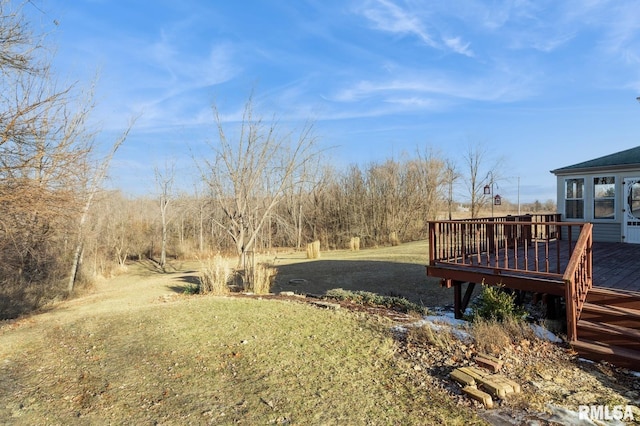 view of yard featuring a wooden deck