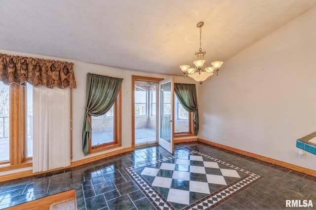 interior space featuring vaulted ceiling and a notable chandelier