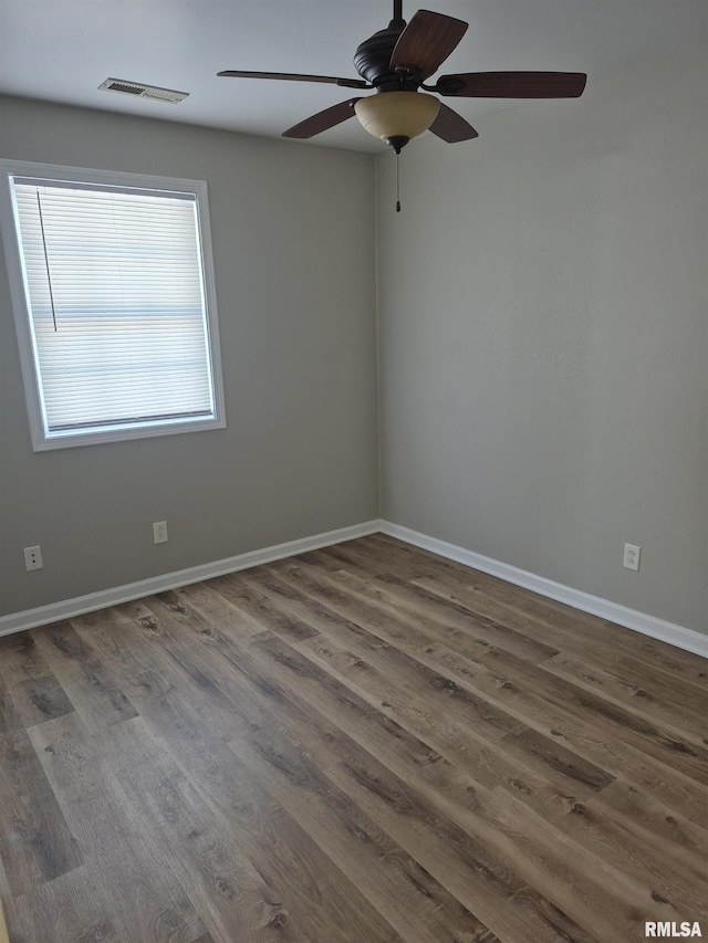 spare room featuring hardwood / wood-style floors