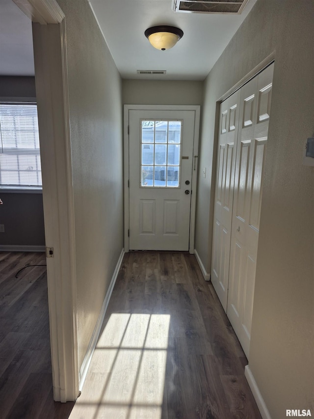 doorway featuring dark hardwood / wood-style floors