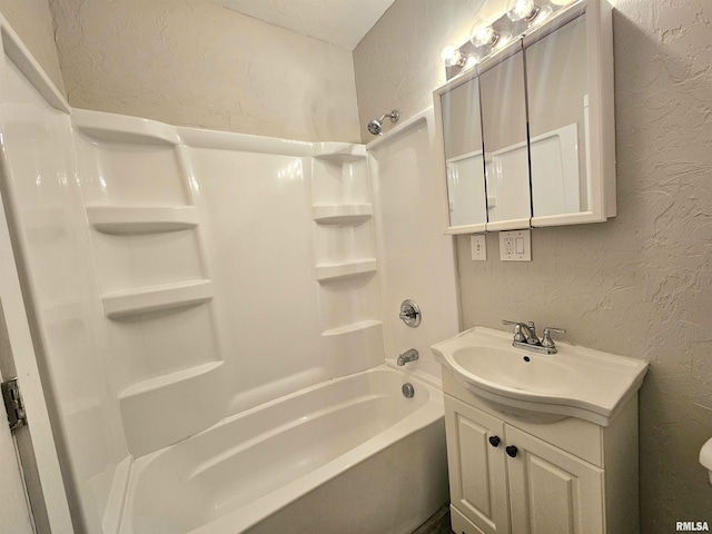 bathroom featuring vanity and tub / shower combination