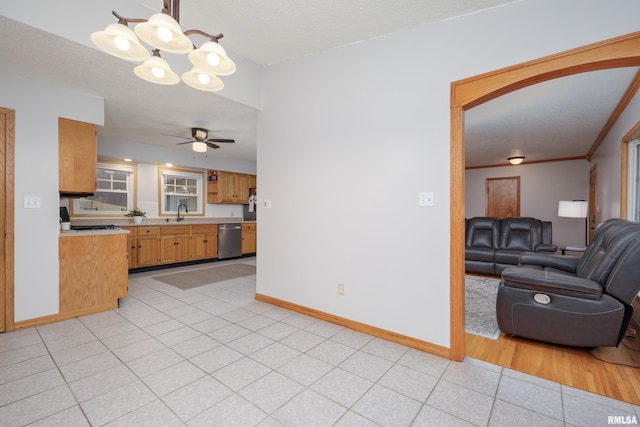 kitchen with light tile patterned flooring, a textured ceiling, dishwasher, pendant lighting, and ceiling fan