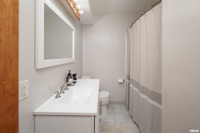 bathroom with walk in shower, vanity, toilet, and tile patterned flooring