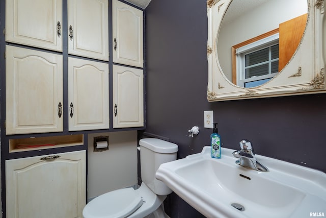 bathroom with sink and toilet