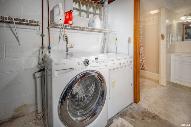 washroom featuring separate washer and dryer