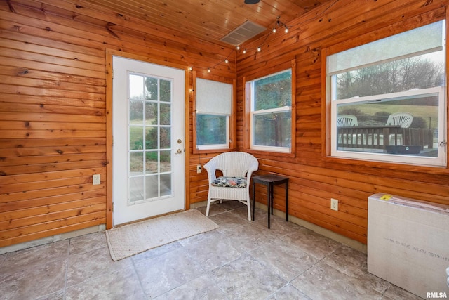 doorway featuring wooden walls