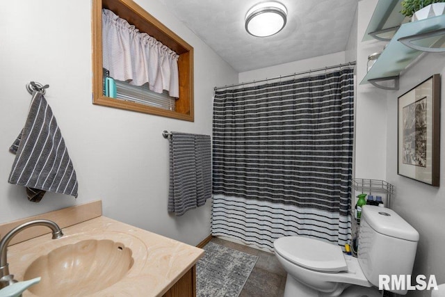 bathroom featuring walk in shower, vanity, and toilet