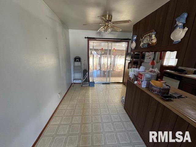 kitchen with ceiling fan and dark brown cabinets