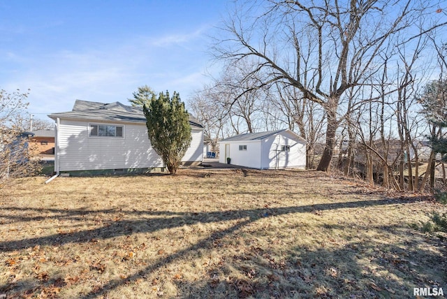 exterior space with a lawn and a storage unit