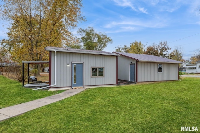 view of outbuilding with a yard