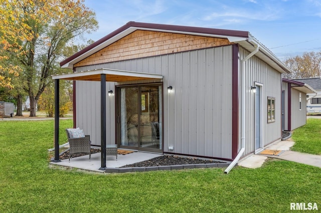 view of outbuilding with a lawn