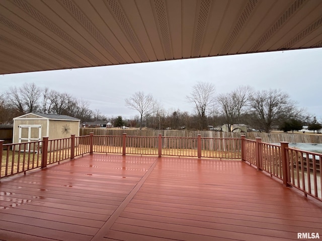 wooden terrace with a shed