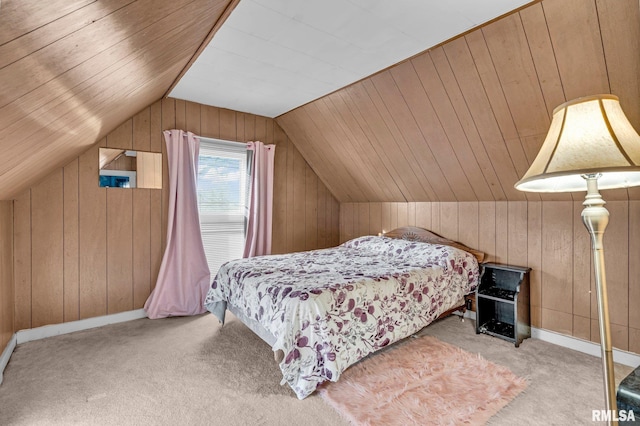 bedroom featuring lofted ceiling, light carpet, and wood walls