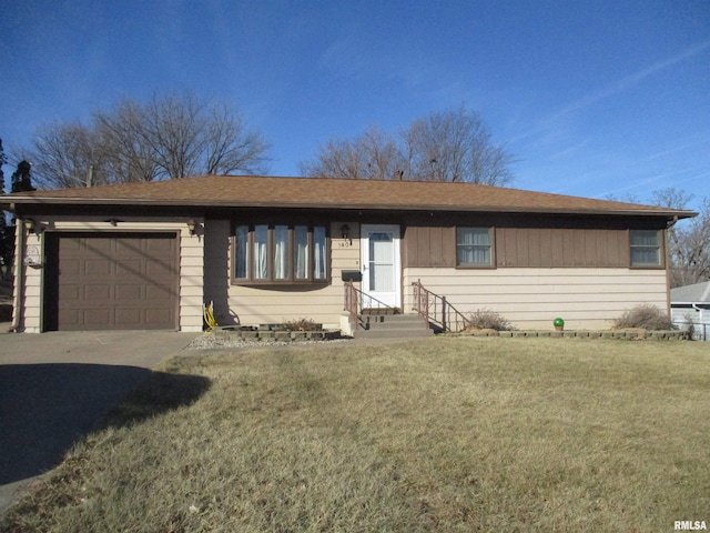 single story home with a garage and a front yard