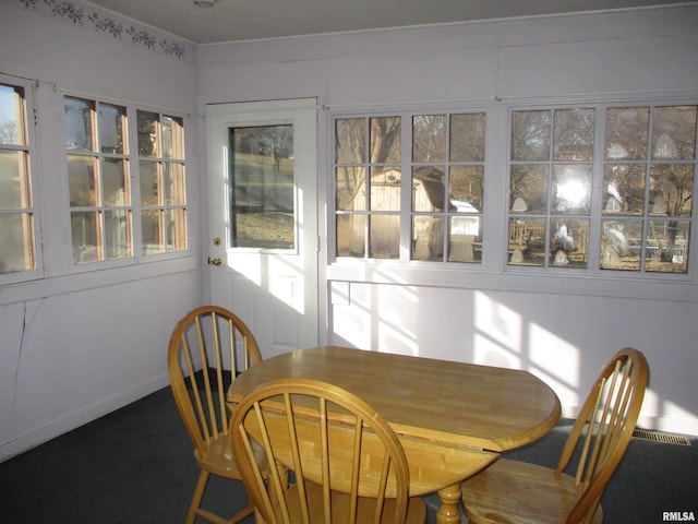 sunroom / solarium featuring plenty of natural light